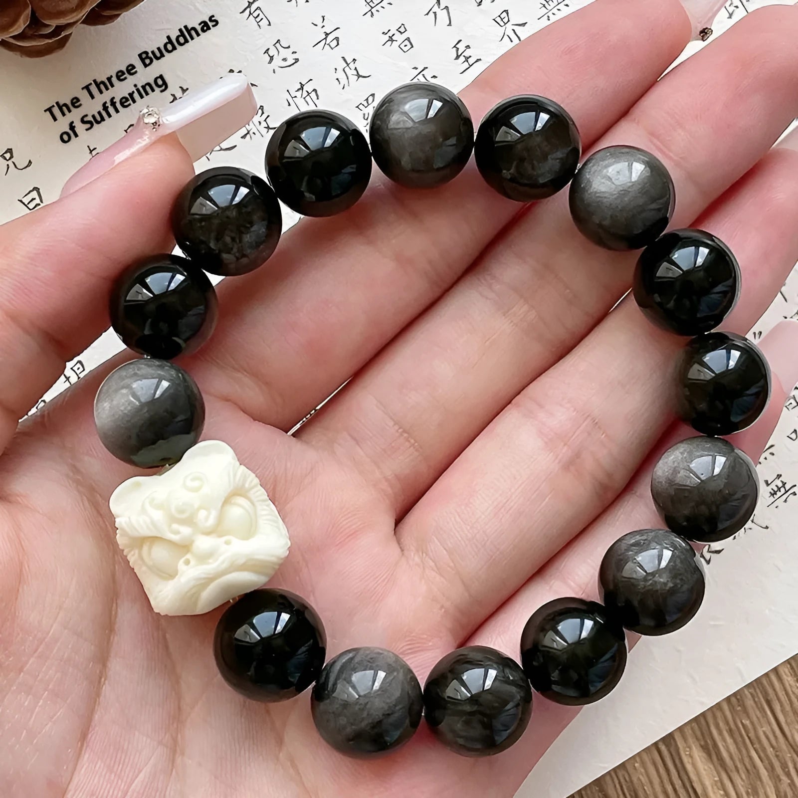Obsidian prayer beads bracelet with manual processing and chamfered square grain details