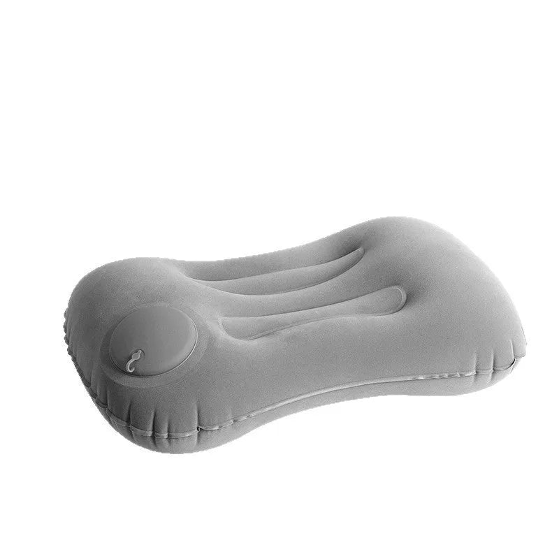 Grey flocking finish portable press inflatable travel pillow for neck support, shown deflated and inflated.