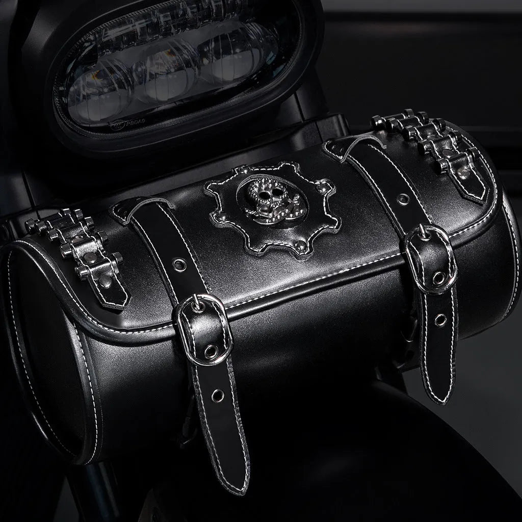 Black punk style retro motorcycle pannier saddle bag made from PU leather, mounted on a bike frame.