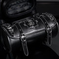 Black punk style retro motorcycle pannier saddle bag made from PU leather, mounted on a bike frame.