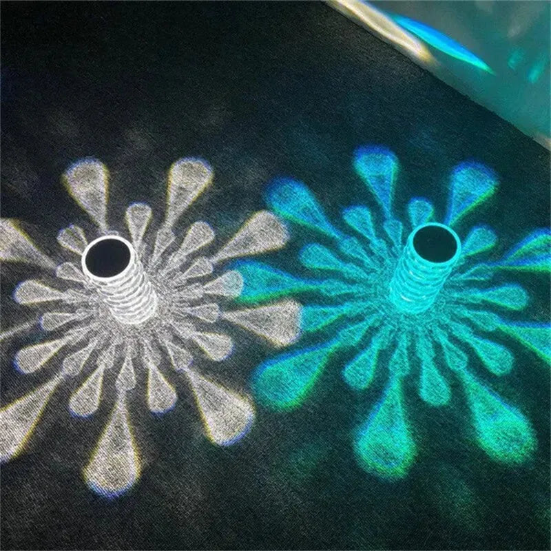 Crystal table lamp with teardrop acrylic shade showing droplet shadow effect on bedside table