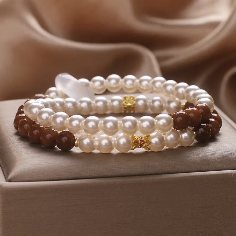 Natural white freshwater pearl and crystal double circle cook stitching flexible bracelet on woman's wrist, 34cm circumference