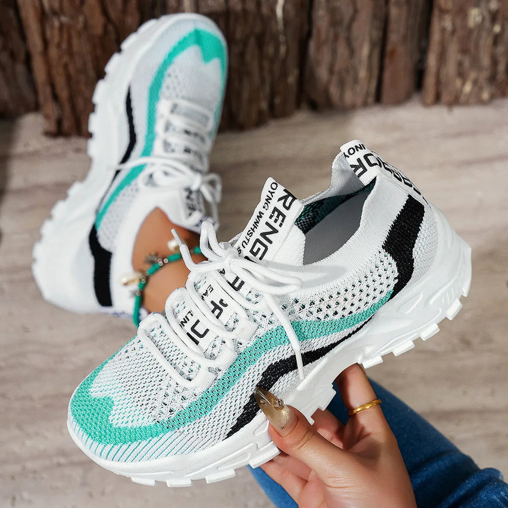 Women's black and white mesh casual sports shoes with a PVC sole and lace-up front.