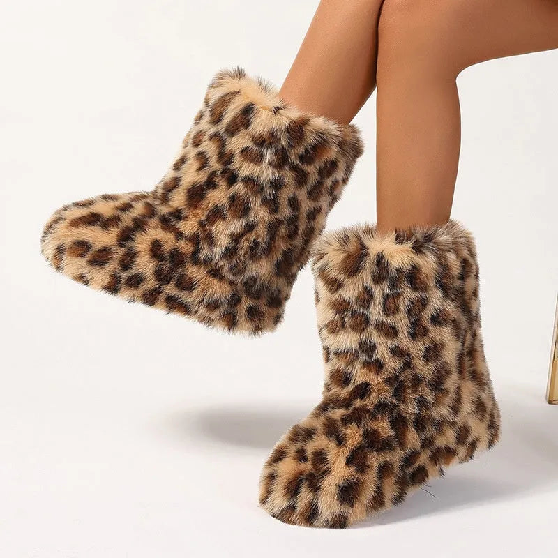 Women's imitation raccoon fur mid-calf boots with flat heel on a neutral background