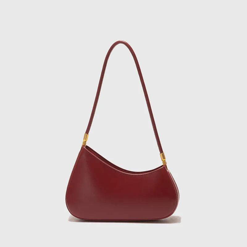 Women's oval-shaped retro underarm bag in various colours with a single shoulder strap.