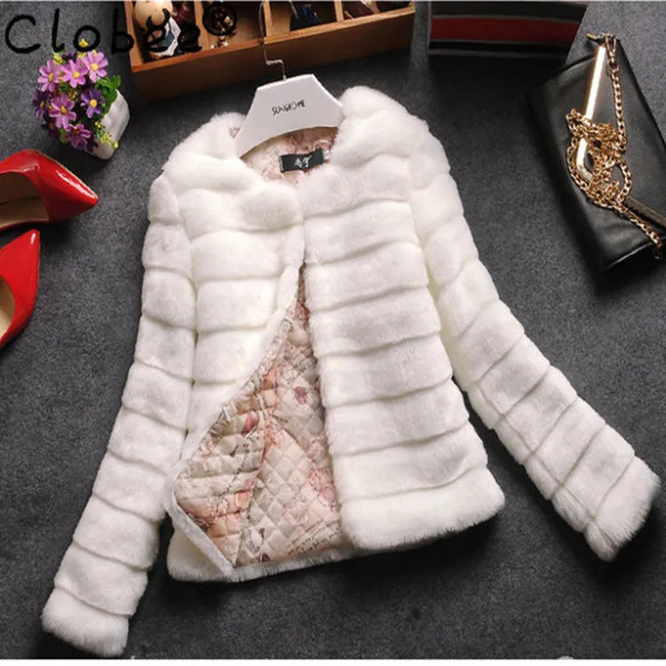 Women's short white faux fur top with regular sleeves, shown on a hanger.