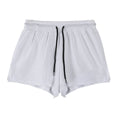 Men's black nylon quick-dry summer shorts laid flat, showing mid-waist and shorts length.