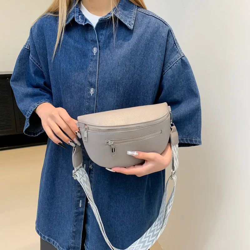 Soft PU crossbody bag in light gray, oval shape, with single shoulder strap and slit pocket