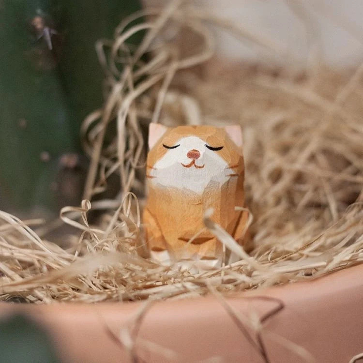 Handcrafted sandalwood kitten ornaments in various styles and colours