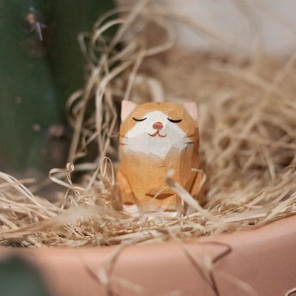 Handcrafted sandalwood kitten ornaments in various styles and colours