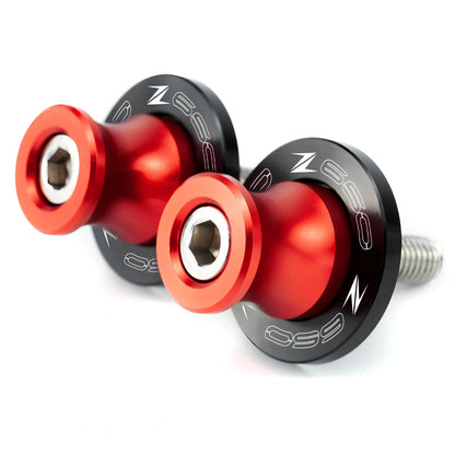 Pair of 8mm CNC aluminium swingarm spools sliders in titanium for Kawasaki Z650 Z900, with Delrin contact and stainless bolts