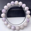 Women's purple turquoise bracelet with natural gemstone beads on a wrist.