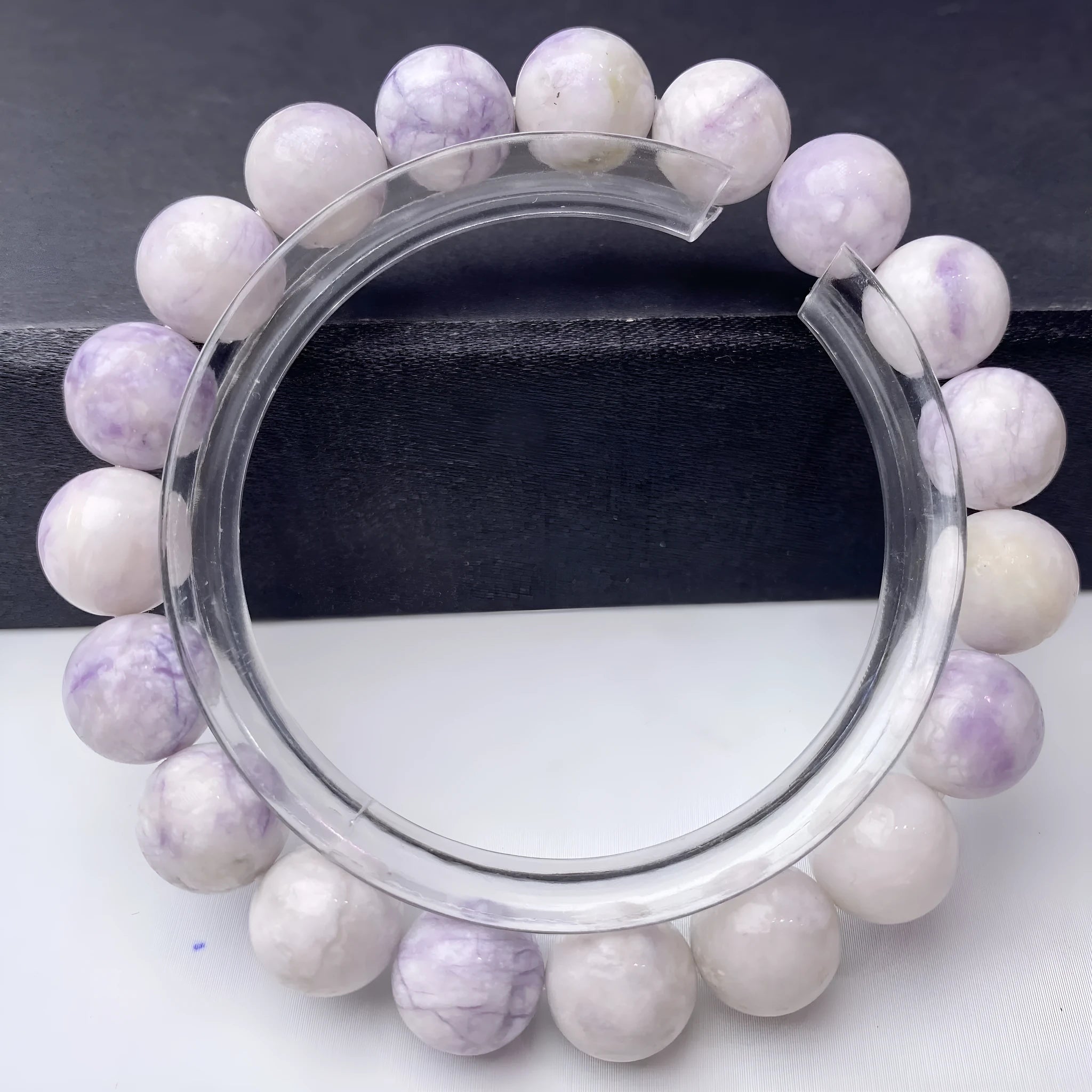 Women's purple turquoise bracelet with natural gemstone beads on a wrist.