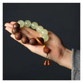 Rosewood bracelet with carved Fu character and amass fortunes motif on 20mm beads