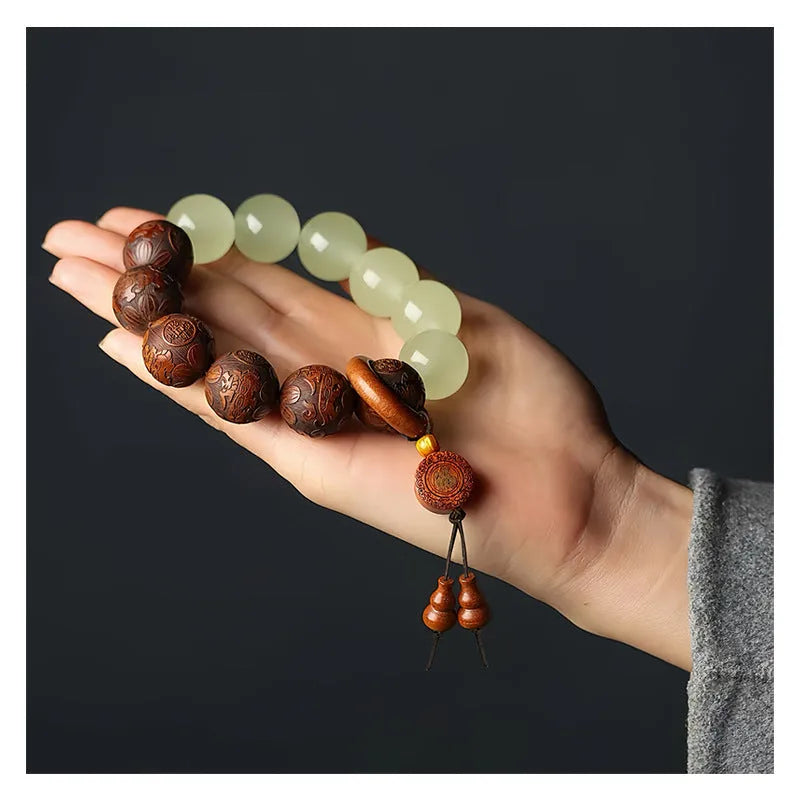 Rosewood bracelet with carved Fu character and amass fortunes motif on 20mm beads