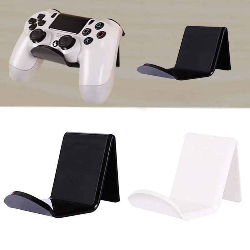 Plastic wall mounting bracket for video game controllers in black, white, or transparent finish.