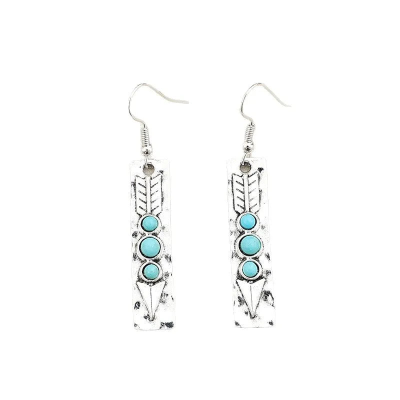 Long silver geometric drop earrings with inlaid turquoise details on a retro-style zinc alloy setting.