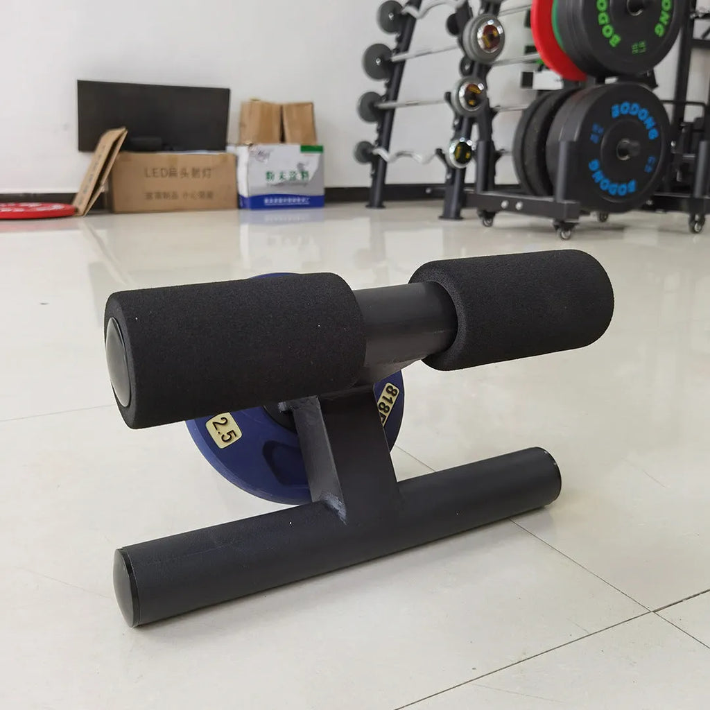 Black steel plate inner calf muscle trainer on a gym floor, dimensions 36x21.5x38.5cm