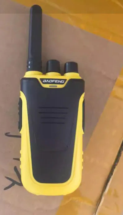 Red and yellow high-power handheld intercom with USB charging port.