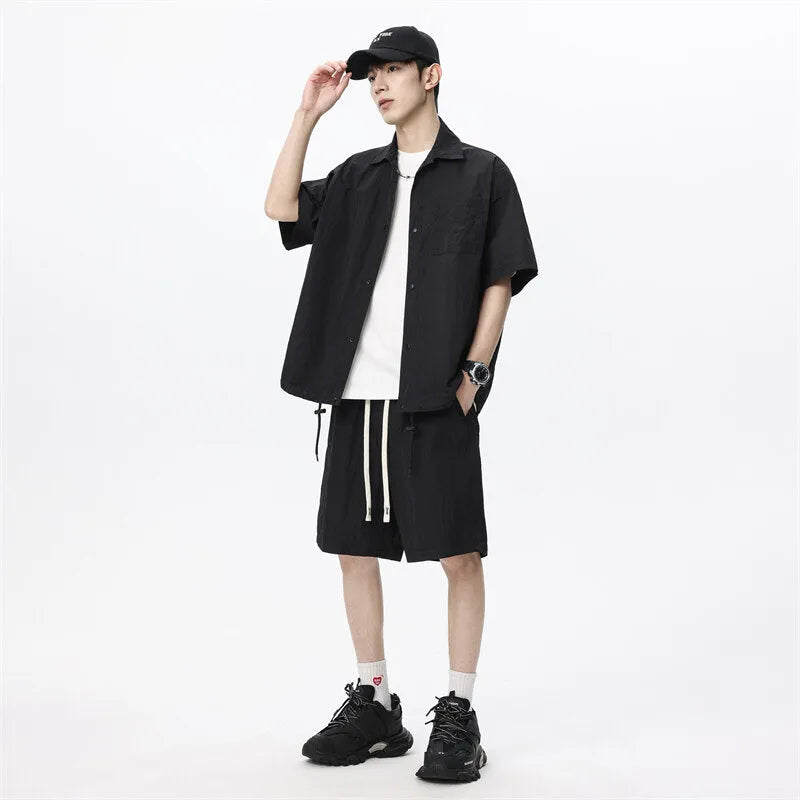 Men's loose grey hemp-blend casual shirt and shorts two-piece set on a hanger
