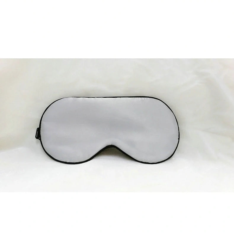Silk eye mask with ice cube gel insert showing navy blue colour and adjustable strap