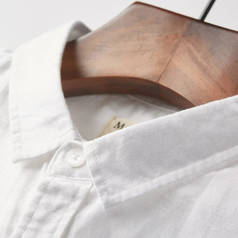 Men's loose fit linen short sleeve shirt with a square collar in sapphire blue.