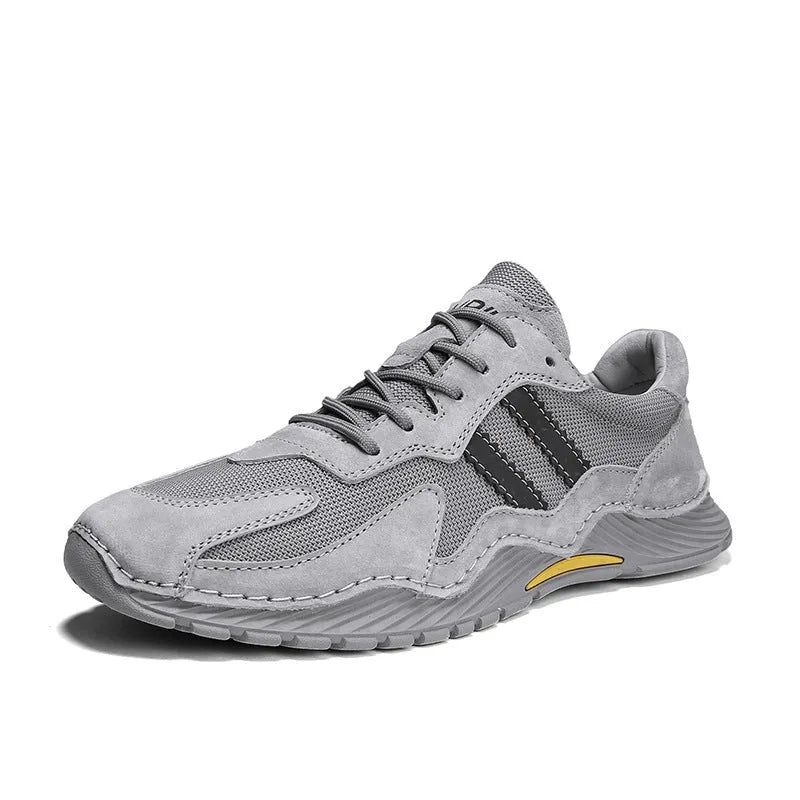 Men's low-top lace-up hiking boots in grey with pigskin upper and platform rubber sole.