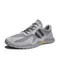 Men's low-top lace-up hiking boots in grey with pigskin upper and platform rubber sole.