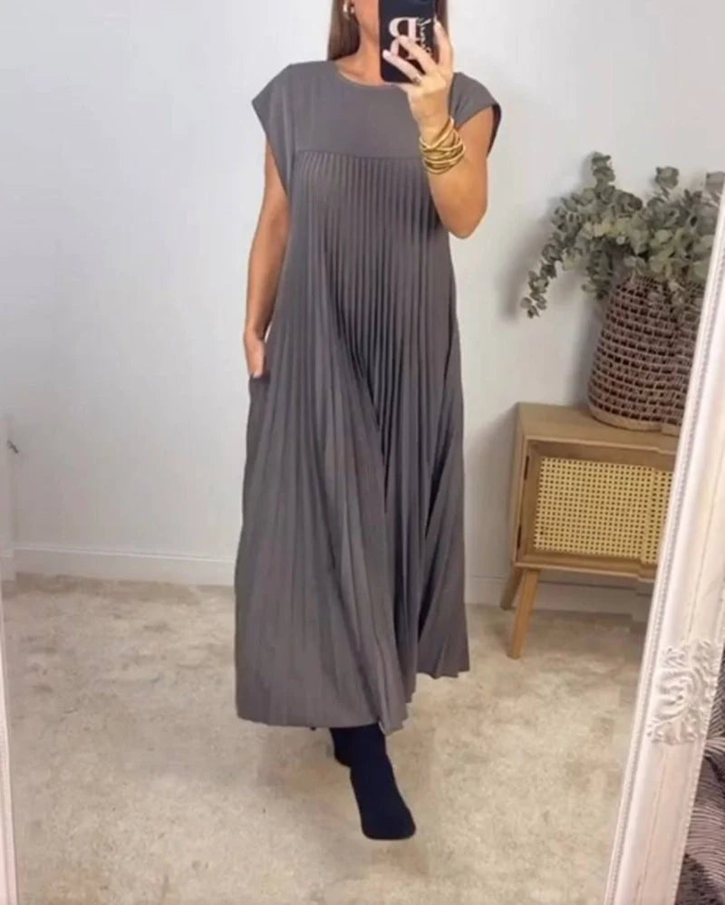 Women's summer pleated long dress in various colours, showcasing the unique design and flattering silhouette.
