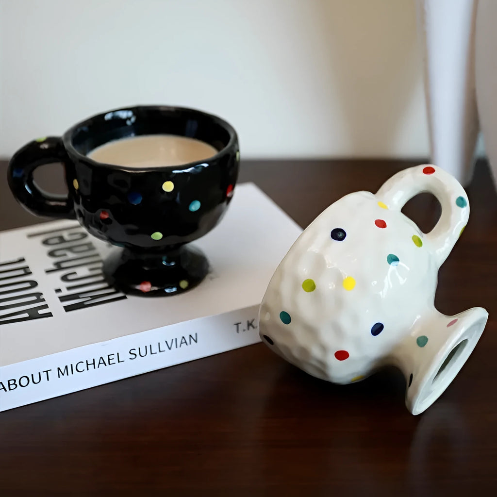 Hand-pinched irregular ceramic mug in a solid colour on a plain background.