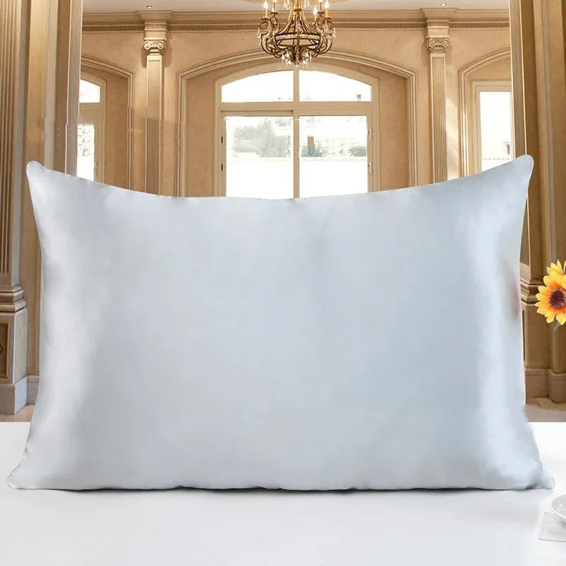19 M double-sided silk pillowcase shown in one of 14 colours, including apricot, champagne, and navy blue.