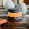 Small orange volcanic rock USB night lamp with warm light, shown next to a USB cable