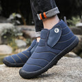 Men's waterproof snow boots in black with a cotton upper and thick rubber sole.