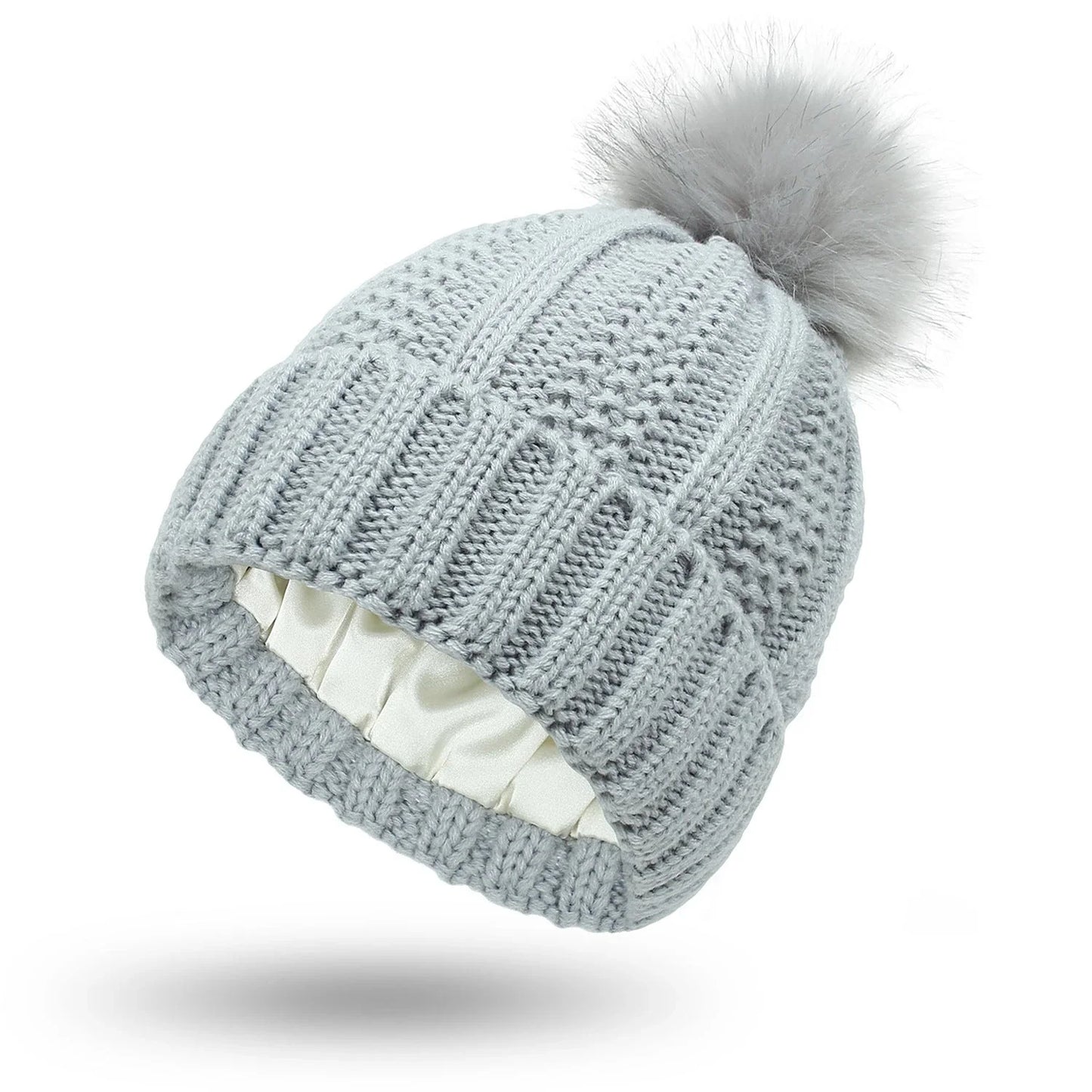 Wool skull knit beanie with satin lining and faux fur pom pom in various colours