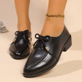 Women's pointed toe PU leather shoes with a bow detail on the upper.