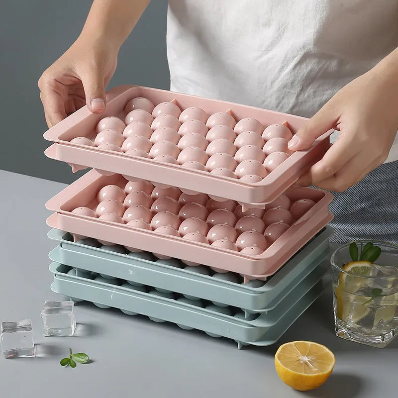 Sky blue and pink round ball ice cube trays showing 18 and 33 grid options