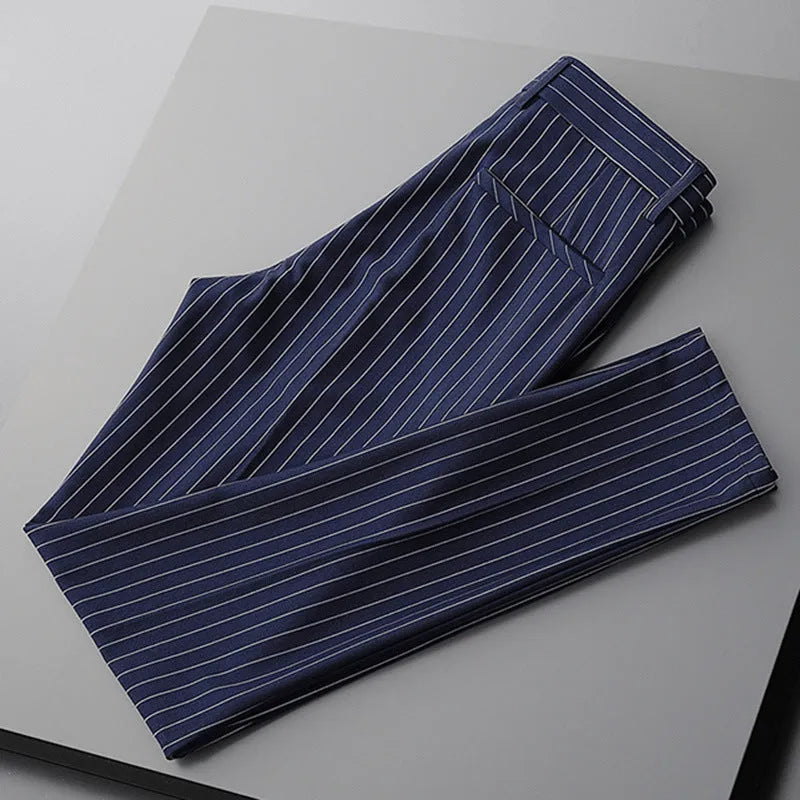 Men's thin loose casual suit pants showing draping design in black and white colour options