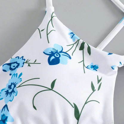 Women's floral pattern tie-neck triangle swimsuit with matching shorts on mannequin