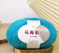 Ball of mohair yarn with Inverness thread for DIY scarf knitting kit in various colours.