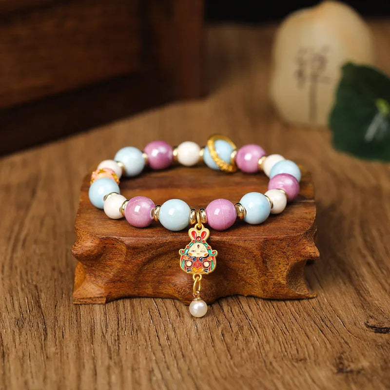 Handmade ceramic lucky rabbit bracelet with grey porcelain glaze on adjustable cord