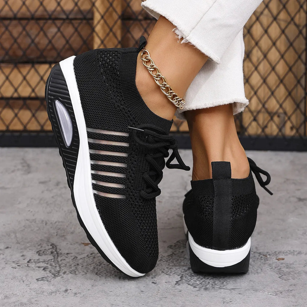 Women's mesh upper lace-up slip-on wedge sports shoes in black, low-top style with mid heel
