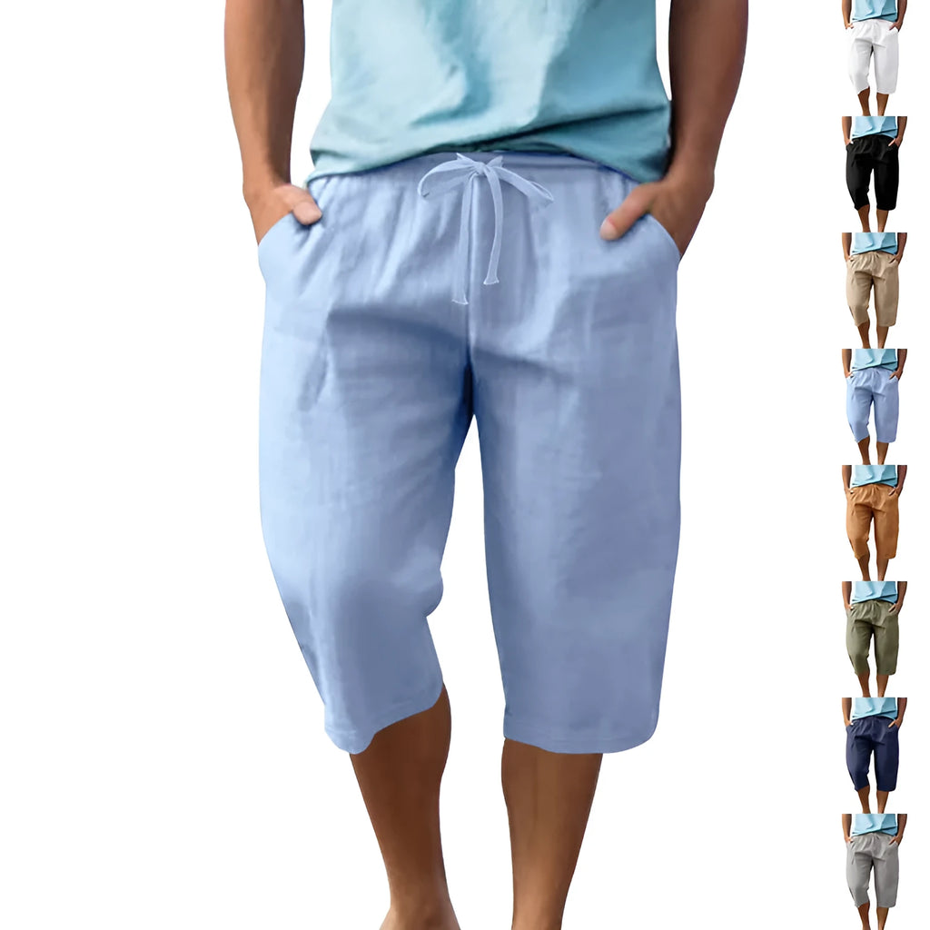 Man wearing loose, cropped linen shorts in a solid colour with a drawstring waist.