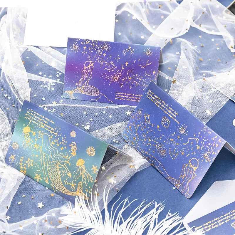 Set of three bronzed, pre-folded paper greeting card envelopes in one of four colour styles.
