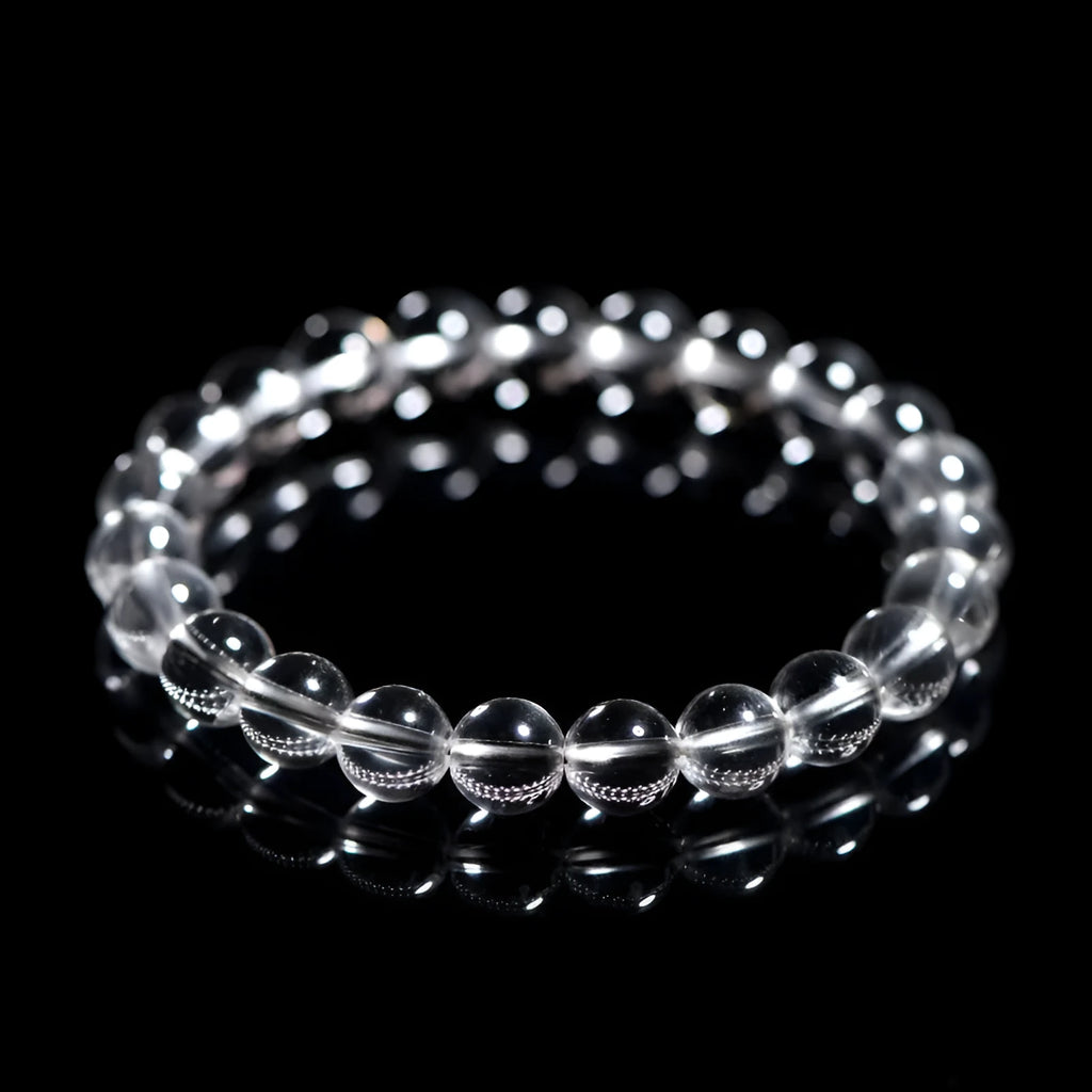 Natural Donghai old mine white crystal round bead bracelet with geometric design on a wrist.