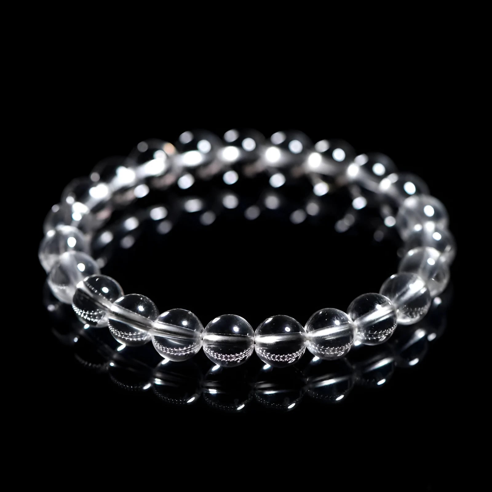 Natural Donghai old mine white crystal round bead bracelet with geometric design on a wrist.