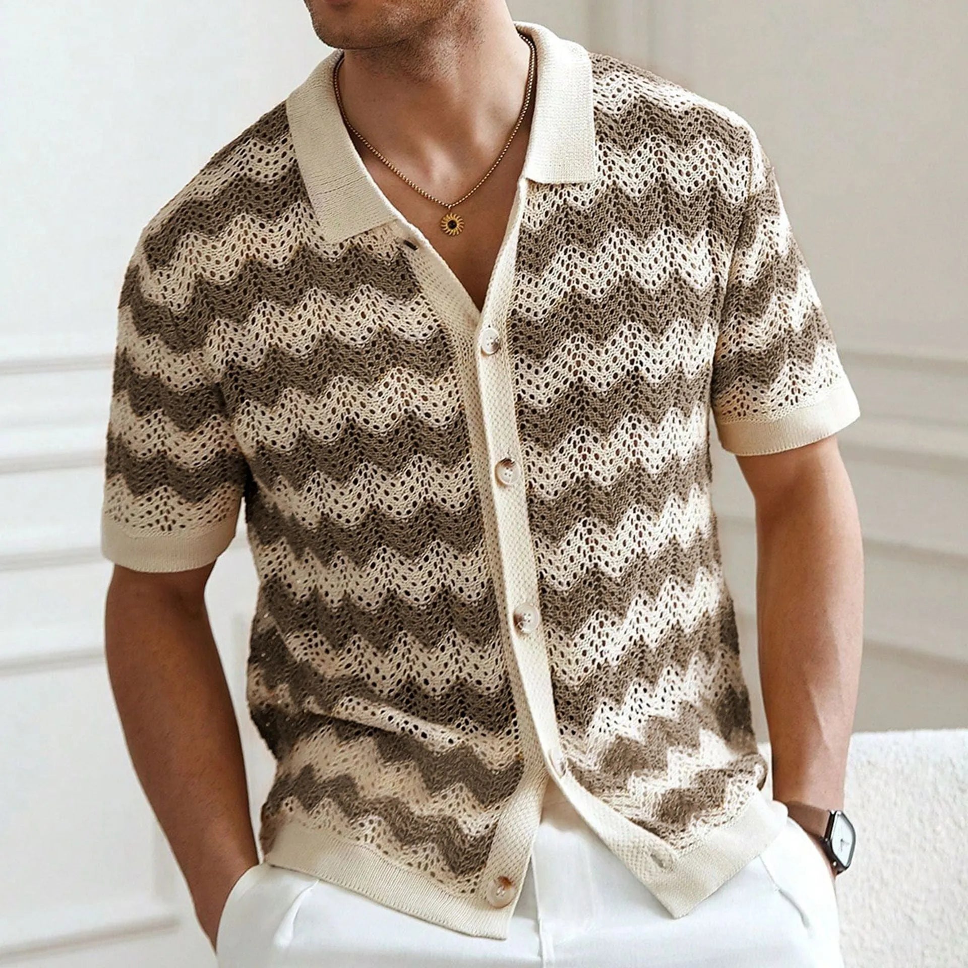 A yellow short-sleeve sweater with a textured corrugated jacquard pattern and a flocked surface detail.