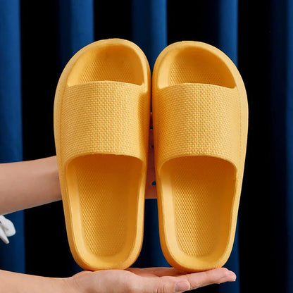 Stylish and comfortable EVA bathroom slippers with soft cushioned soles and anti-slip design, available in a variety of vibrant colors.