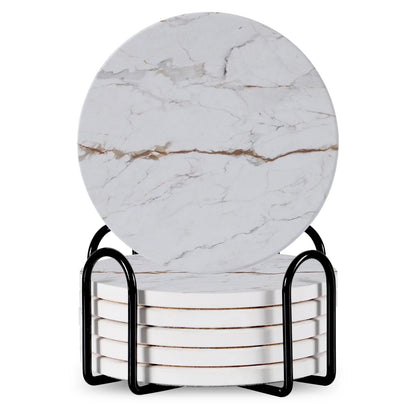 Set of 6 round ceramic coasters with metal stands and cork bases on a wooden table