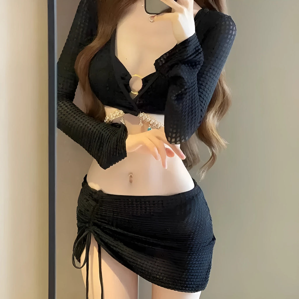 Women's long sleeve black and white bikini swimsuit with split bottoms for swimming