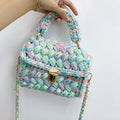 Hand knitted crochet cotton tote crossbody bag in Cotton Candy colour, horizontal square shape with lock closure and shoulder strap.